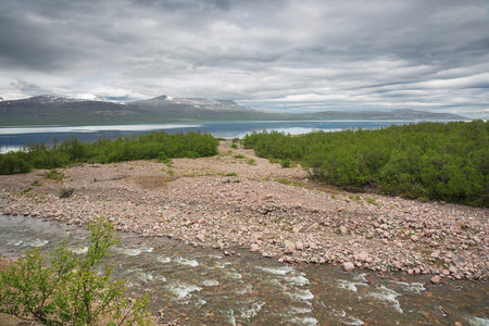 The Pessijoki river flowing in Lake Tornetrask in the vicinity of Abisko National Park