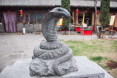 Editorial: PINGYAO, SHANXI, CHINA, April 10, 2019 - Statue of a snake in the City God Temple in the old town of Pingyaoのeditorial素材