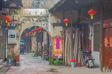 Editorial: DAXUZHEN, GUANGXI, CHINA, April 21, 2019 - Looking through a gate in Main Street in the old town of Daxuzhenのeditorial素材
