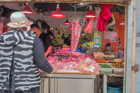 Editorial: SHANGHAI, CHINA, April 17, 2019 - Bustle in a butchery in an old city neighborhood in Shanghaiのeditorial素材