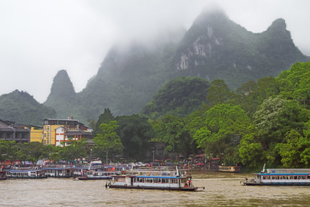 Editorial: GUILIN, GUANGXI, CHINA, April 19, 2019 - Intense activity at Xingpingzhen fishing village on the Li River in the vicinity of Yangshuo near Guilinのeditorial素材