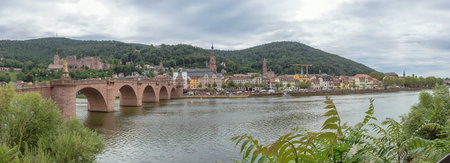Editorial: HEIDELBERG, BADEN-WURTTEMBERG, GERMANY, August 17, 2019 - Panorama of the old city of Heidelberg with the Old Bridge seen from the right bank of the riverのeditorial素材