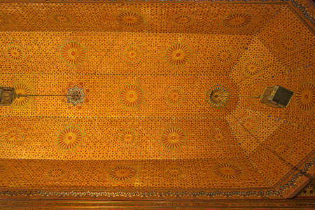 Detail of the Beautifully decorated ceiling in the reception hall in the Bahia Palace in Marrakechの写真素材