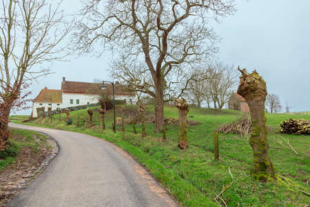 Idyllic farm on top of a hill in the Flemish Ardennesの写真素材