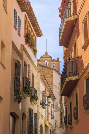 A shady street in Guadix near the Saint Augustin church