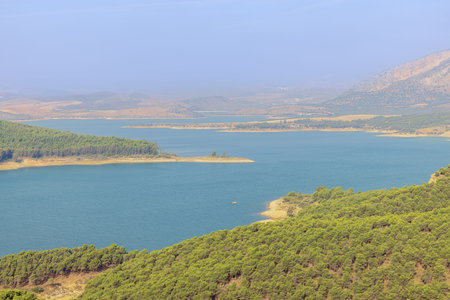 The Guadalhorce reservoir coming out of the morning mist, seen from the outlook of the three reservoirs in Campillosの写真素材