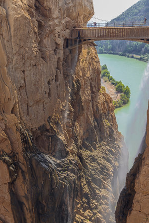 Editorial: CAMINITO DEL REY, ARDALES, ANDALUSIA, SPAIN, OCTOBER 1ST, 2021 - A mist of water pouring down from the bridge over the Guadalhorce gorge along the King's pathway near the southern exitのeditorial素材
