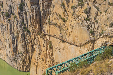 Editorial: CAMINITO DEL REY, ARDALES, ANDALUSIA, SPAIN, OCTOBER 1ST, 2021 - Close up of the King's pathway at the exit, hanging above the Tajo de la Encantada reservoirのeditorial素材
