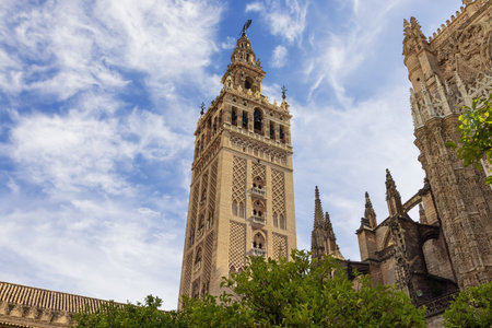 Seville's Cathedral with the Giralda and the Giraldillo. On the tower part of the inscription is visible which says The name of the Lord is a fortified towerのeditorial素材