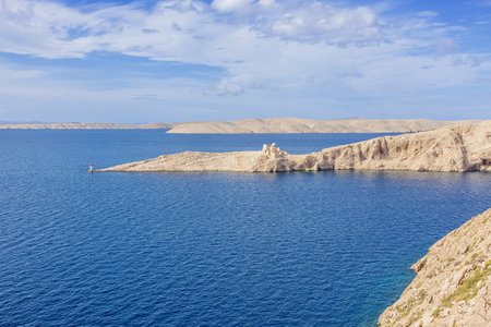 The ruins of Fortress Fortica with the Adriatic coastline, seen from the Pag Bridgeのeditorial素材