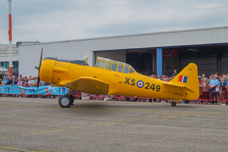 Editorial: DEURNE, FLANDERS, BELGIUM, MAY 21, 2023 - Side view of a North American AT-16 Harvard IIB on static display at the 100th anniversary of Antwerp Airportのeditorial素材
