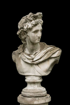 Marble head of an ancient Greek god bust isolated on black background.の写真素材