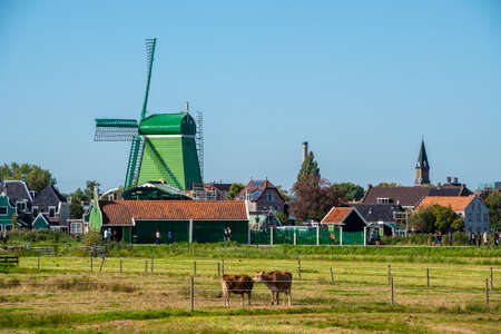 Zaanse Schans, Netherlands - 1 October 2019: Tourists sightseeng traditional Dutch rural houses in Zaanse Schans, is a typical small village within Amsterdam area.のeditorial素材