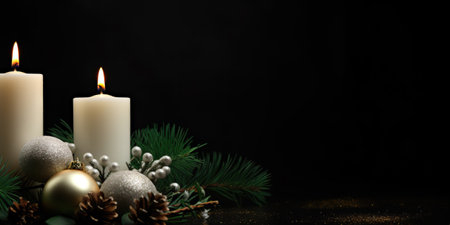 Christmas holiday ornament composition with candles and christmas tree branches, isolated on green background with copy spaceの写真素材
