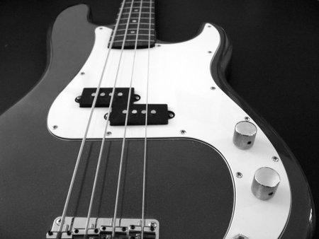 black and white close-up of a base guitarの写真素材