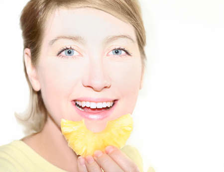 Woman eat pineappleの写真素材