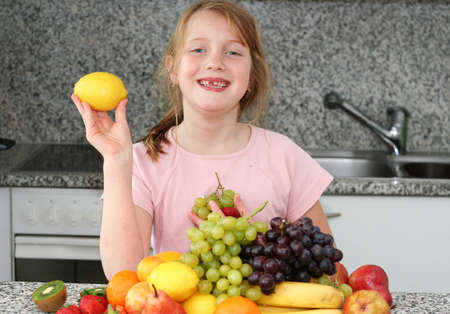 Girl with citrus in the handの写真素材