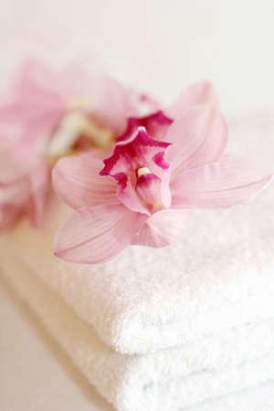 White towels with orchidsの写真素材