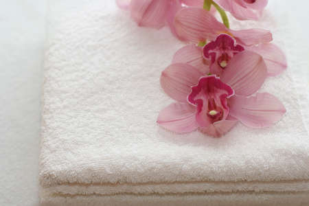 White towels with orchidsの写真素材