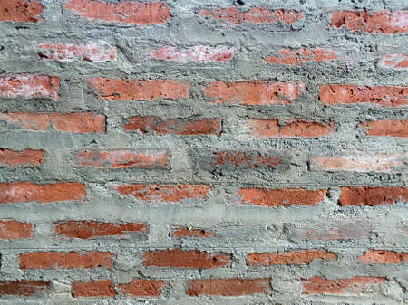 Background of old vintage red brick wallの写真素材