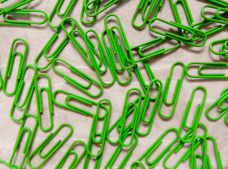 green paper clip (background)の写真素材