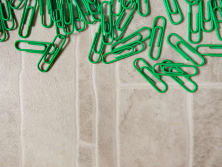 green paper clip (background)の写真素材
