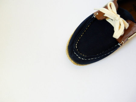 blue shoes laces on white backgroundの写真素材