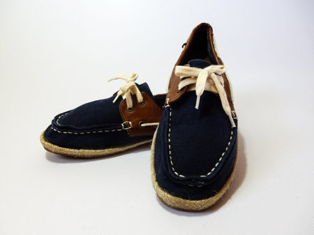 blue shoes laces on white backgroundの写真素材