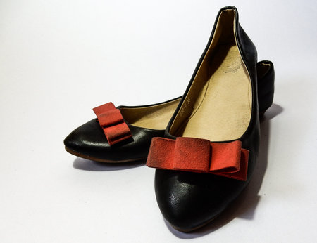 old black brogan shoes on white backgroundの写真素材