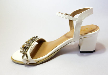 white hight heel shoes with diamond on white backgroundの写真素材