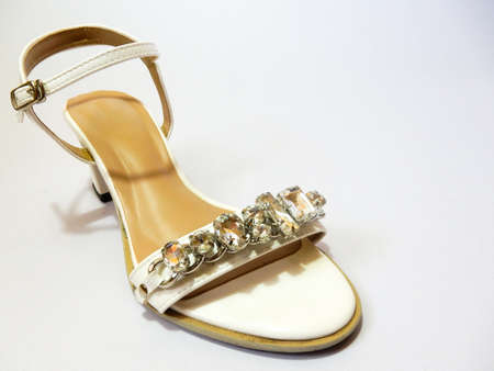 white hight heel shoes with diamond on white backgroundの写真素材