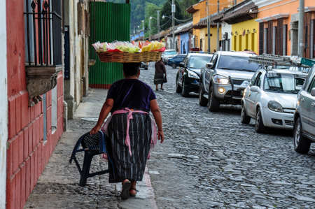 Traditional woman selling fruits in Antigua, Guatemala.のeditorial素材