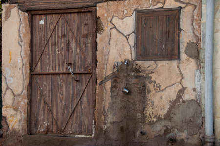Old house with wooden door, Saudi Arabia.の写真素材