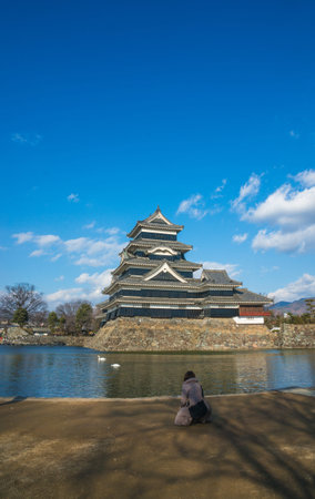 a girl looking at Matsumoto castleのeditorial素材