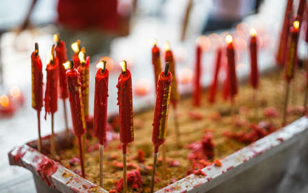 Flaming candles in chinese templeの写真素材