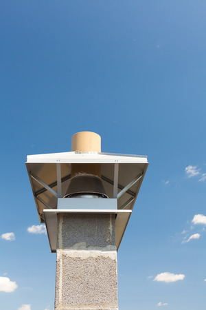 New chimney (smokestack) with metal box closeupの写真素材