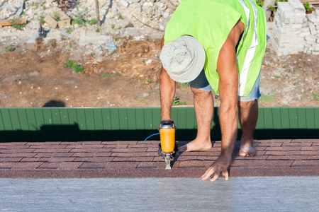 New roof shingle being appliedの写真素材