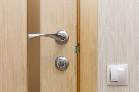 View of a door handle of an opened new doorの写真素材