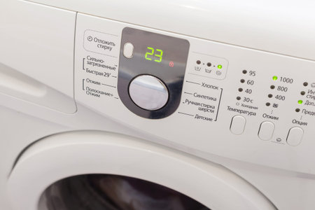 Display washing machine. Macro photo part of modern home washing machine