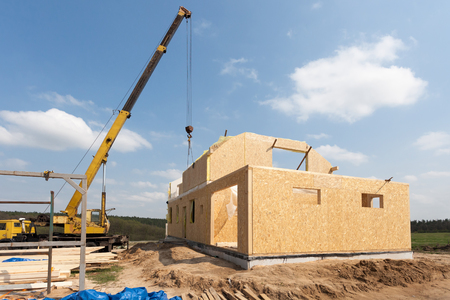 New construction of a house/Framed New Construction of a House/Building a new house from the ground upの写真素材