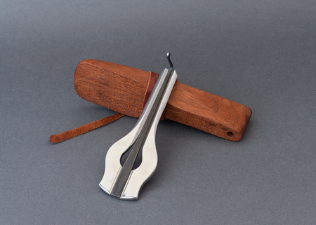 Jew's harp with wooden case on grey backgroundの写真素材