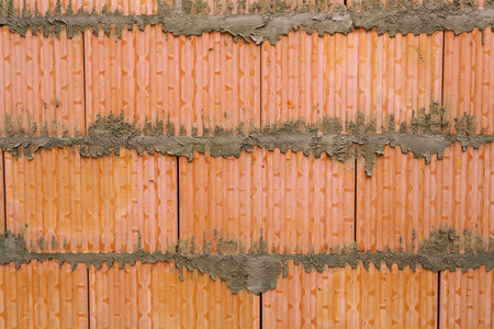 Background of brick wall texture in house under constructionの写真素材