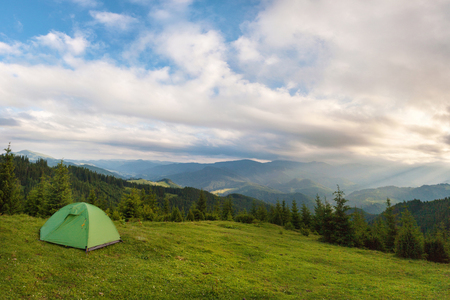 The tent is set on the slopes of the Carpathian Mountains.の写真素材
