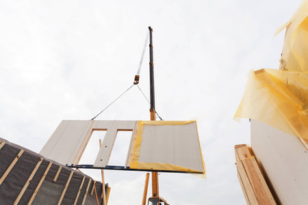 Installing structural Insulated Panels SIP. Building new frame energy-efficient houseの写真素材