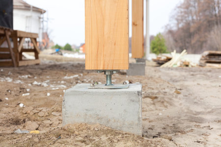 Wooden pillar on the construction site concrete with screw. Wooden Pillars are structures that can be placed on Foundations or Platforms.の写真素材