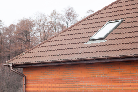 Stone Coated Metal tile Roof with skylights and rain gutterの写真素材