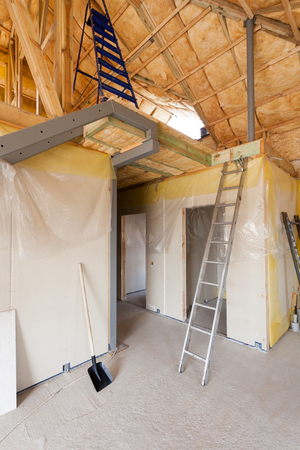 A room at a newly constructed home is sprayed with liquid insulating foamの写真素材