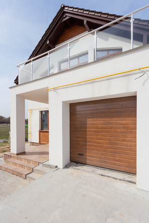 Building New House with Ceramic Tiles Roofing, Garage and balconyの写真素材