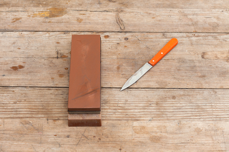 Sharp sharpen knife with grindstone.の写真素材