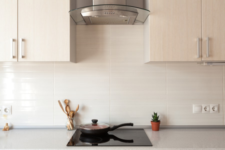 Closeup of exhaust hood and ceramic cooking plate in the new modern kitchenの写真素材
